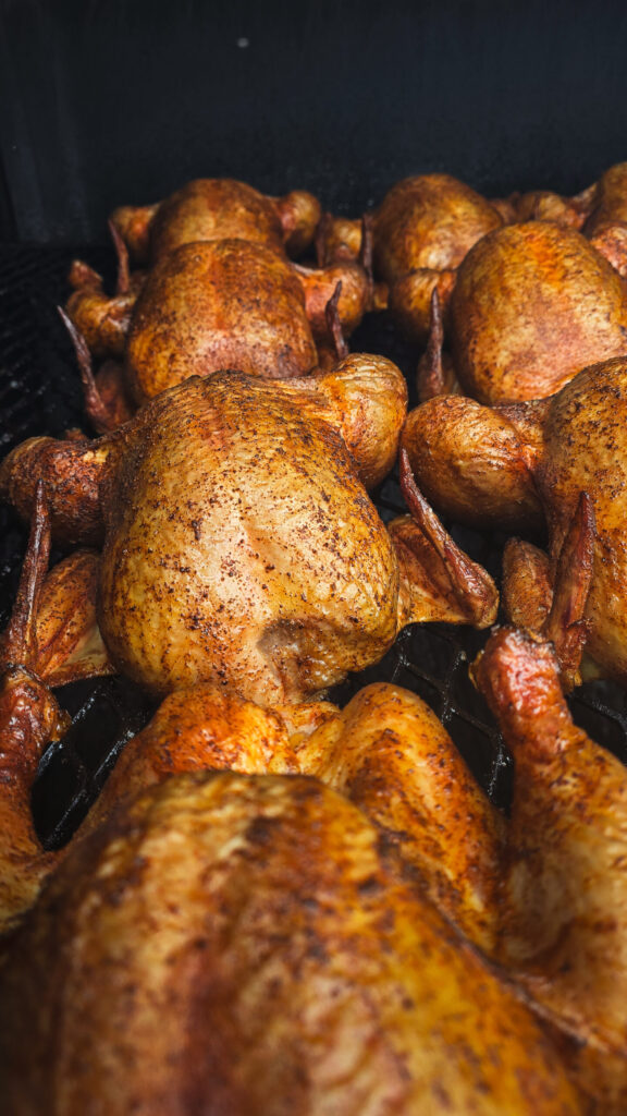 Seven slow-roasted chickens in Morse et Marteaux BBQ's thousand-gallon smoker at Parlee Beach, in Shediac, New Brunswick.